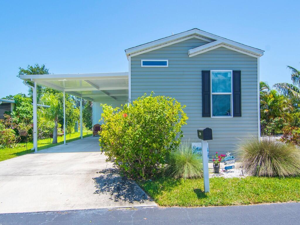 Welcome to this gorgeous manufactured home in the welcoming 55+ community of Sandhill Shores! This home is in excellent condition, with new floors in the kitchen and also freshy painted! Lovely private backyard with a canal view, perfect for relaxing and enjoying Florida life.