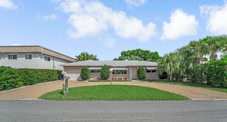 Palm Beach Shores mid century coastal charm built in 1955, this 3BR/2BA home sits on an oversized lot just a short walk to the beach, shops, Sailfish Marina, and Phil Foster Park. Coastal living with a spacious open living/dining area, cozy fireplace, and full-size pool table, perfect for gatherings with friends and family. Split floor with large windows fill the home with natural light. Outdoors, enjoy a private pool and hot tub with room to expand. Move in today or update over time to build equity and create your dream island retreat. This is a rare opportunity to build equity on one of Palm Beach County’s most exclusive barrier islands with limited land available. Being offer As-Is, call LA to show