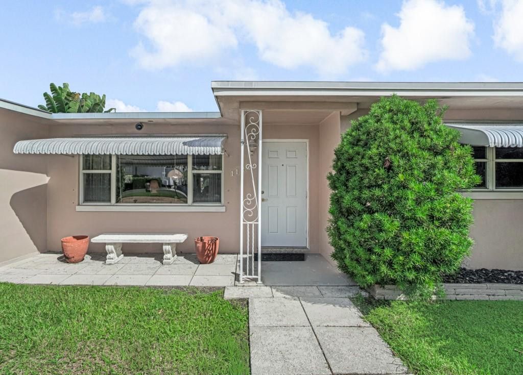 Photo of 1122 Beach Road, Singer Island, FL 33404 (MLS # F10529112)