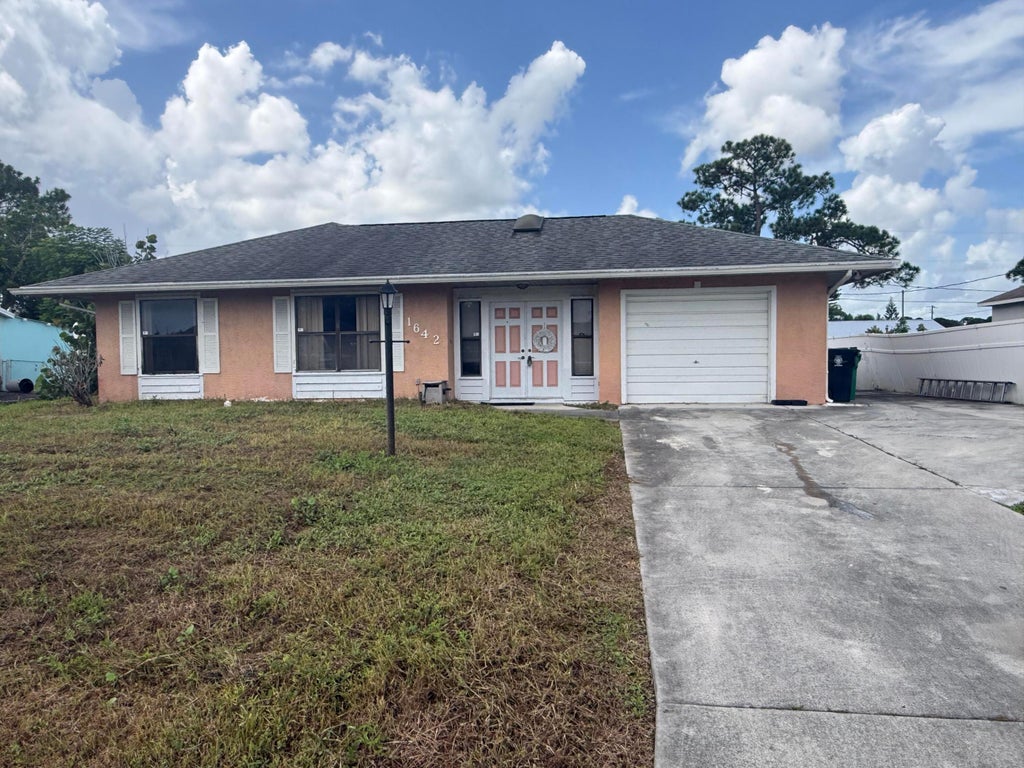 Photo of 1642 SE Ocean Lane, Port Saint Lucie, FL 34983 (MLS # B26075474)