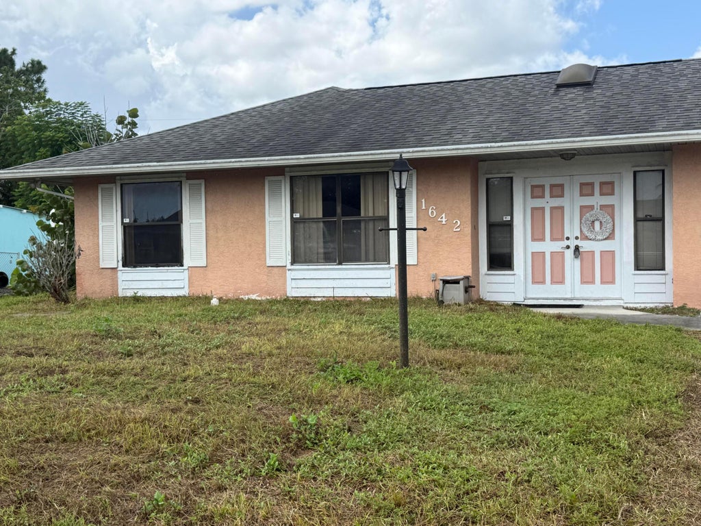 Photo of 1642 SE Ocean Lane, Port Saint Lucie, FL 34983 (MLS # B26075474)