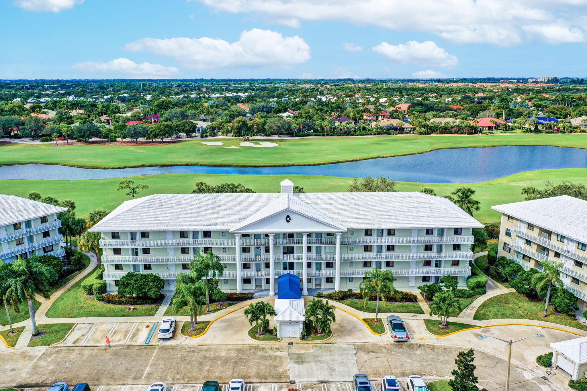 Enjoy South Florida living from this desirable 1st Floor CORNER unit in the well-established community of Whitehall. This charming 2 bedroom, 2 bath, PLUS laundry/bonus room, offers split floor plan, stainless steel appliances, newer A/C (2023) and accordion hurricane shutters! This well maintained condo offers tons of natural light and is privately nestled on a golf course and lake view building. Exceptional value for this super neat and clean condo! Can rent immediately!