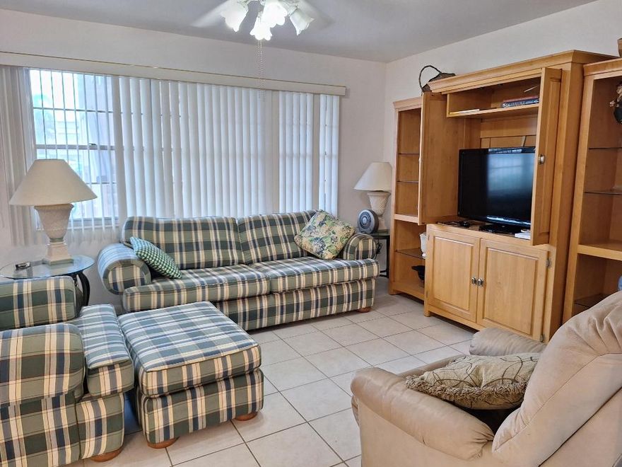 Ground floor apartment in Wolverton!  Bright spacious 1 bedroom 1.5 bathroom fully furnished and ready for you to move in!  Step-in shower - not tub!  Enjoy relaxing in the closed-in lanai overlooking the water.  Walking discance to the clubhouse and houses of worship.  Come check out the amazing club house and all the amenitites in this 55+ community.