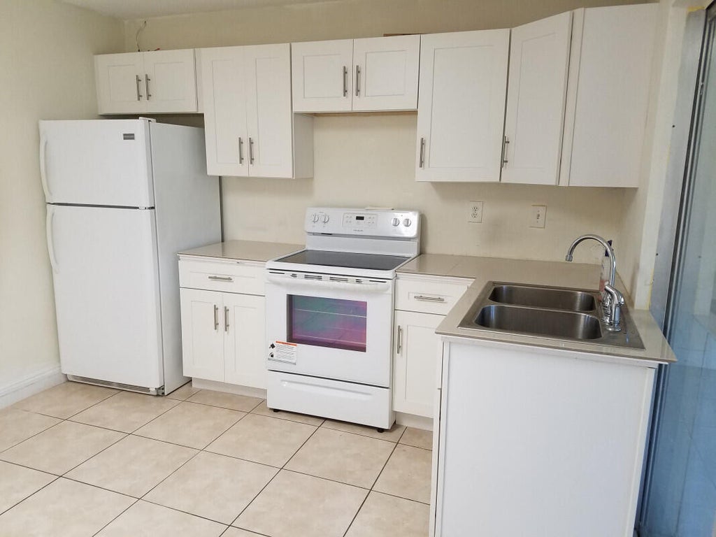 Photo of 4934 NW 55th Court, Tamarac, FL 33319 (MLS # B26056073)