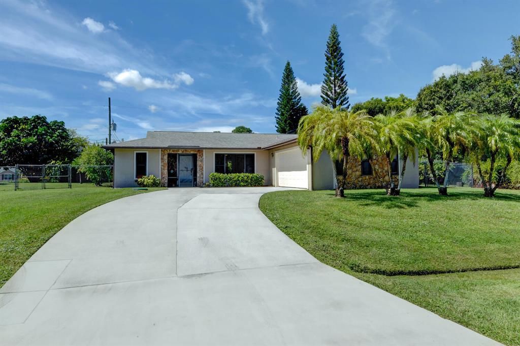 Photo of 1938 SW Agnes Street, Port Saint Lucie, FL 34953 (MLS # R10749556)