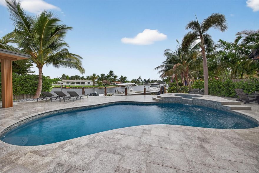 Welcome to this truly unique Waterfront Paradise in Garden Isles. This furnished and modern sanctuary offers an exceptional coastal lifestyle in the heart of Pompano Beach, ideal for a tenant who demands the highest quality. Features include 60 feet of seawall with unobstructed canal views, private dock, an expansive travertine patio, a refinished heated pool and spa and a fabulous outdoor kitchen. The interiors boast luxury finishes, large profile tile, custom cabinetry, and premium upgrades like full impact windows and electric privacy shades. The private primary wing is a resort-inspired escape with a curbless shower, soaking tub, and custom walk-in closet. The home also includes a fully equipped garage gym. True South Florida Living! Available now for lease, 6 months to 1 year.