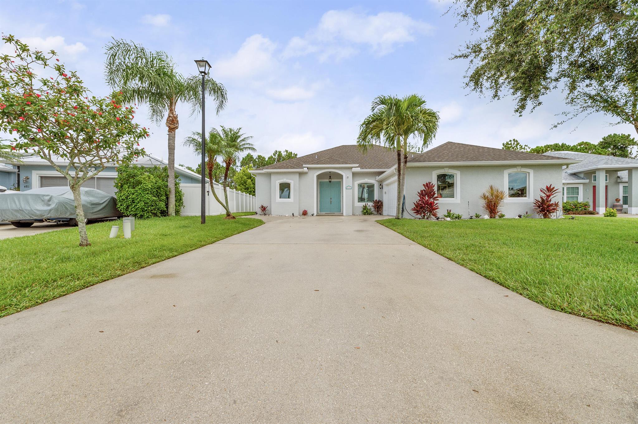 Welcome to this spacious 4-bed, 3-bath CBS home located in the highly sought-after Pines community. This desirable split-bedroom open-concept floor plan offers new tile flooring throughout and soaring 10-foot ceilings. The kitchen features brand-new appliances and ample storage. The oversized primary suite includes two walk-in closets and a luxurious ensuite with dual sinks, a soaking tub, and a separate walk-in shower. Step outside to a covered patio and fire pit area backing a tranquil preserve - with plenty of room to add a pool! The 2-car garage is spacious enough to accommodate a boat and golf cart. Conveniently located just minutes from the beach, shopping, dining, and top-rated schools. Impact windows for full storm protection and recently repainted. This home is move-in ready!