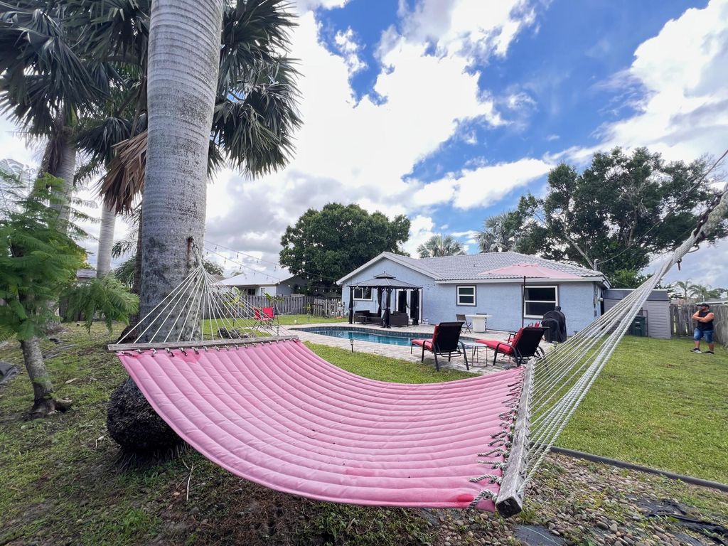 Photo of 970 SW Versailles Avenue, Port Saint Lucie, FL 34953 (MLS # R11103363)
