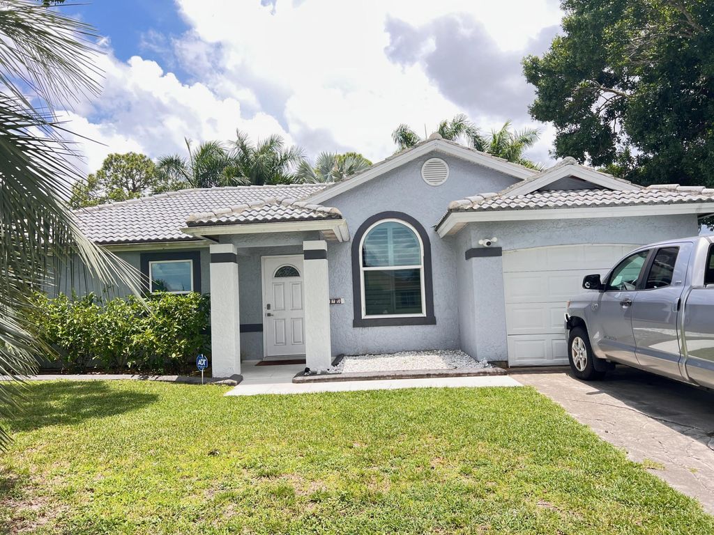 Photo of 970 SW Versailles Avenue, Port Saint Lucie, FL 34953 (MLS # R11103363)