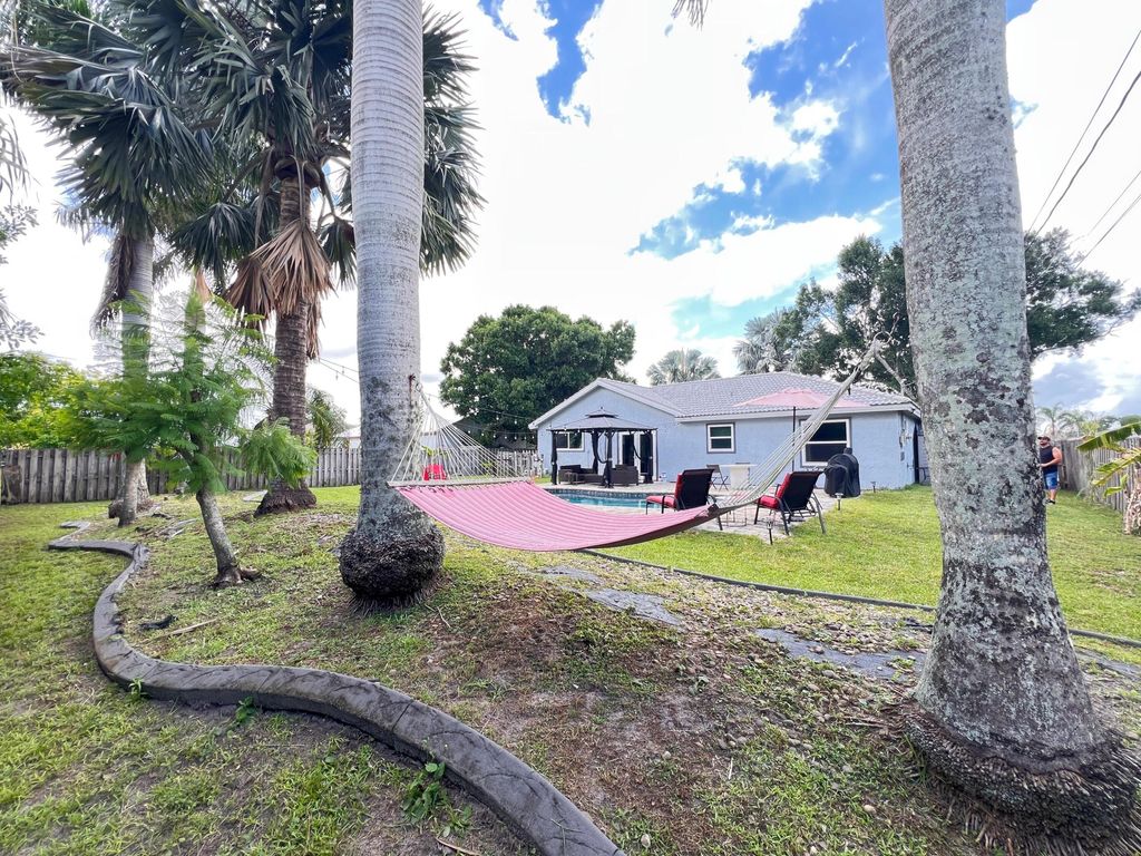 Photo of 970 SW Versailles Avenue, Port Saint Lucie, FL 34953 (MLS # R11103363)