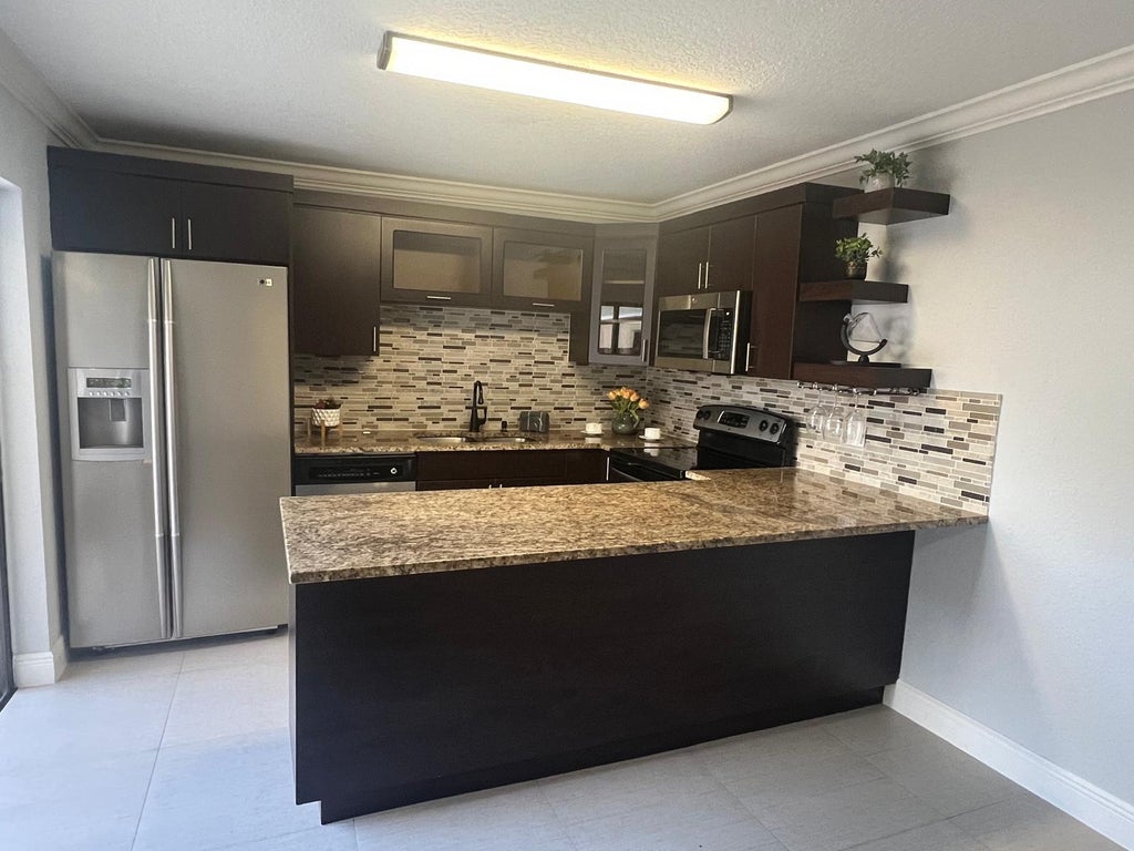 Photo of 2315 Caroma Lane, West Palm Beach, FL 33415 (MLS # B26081358)