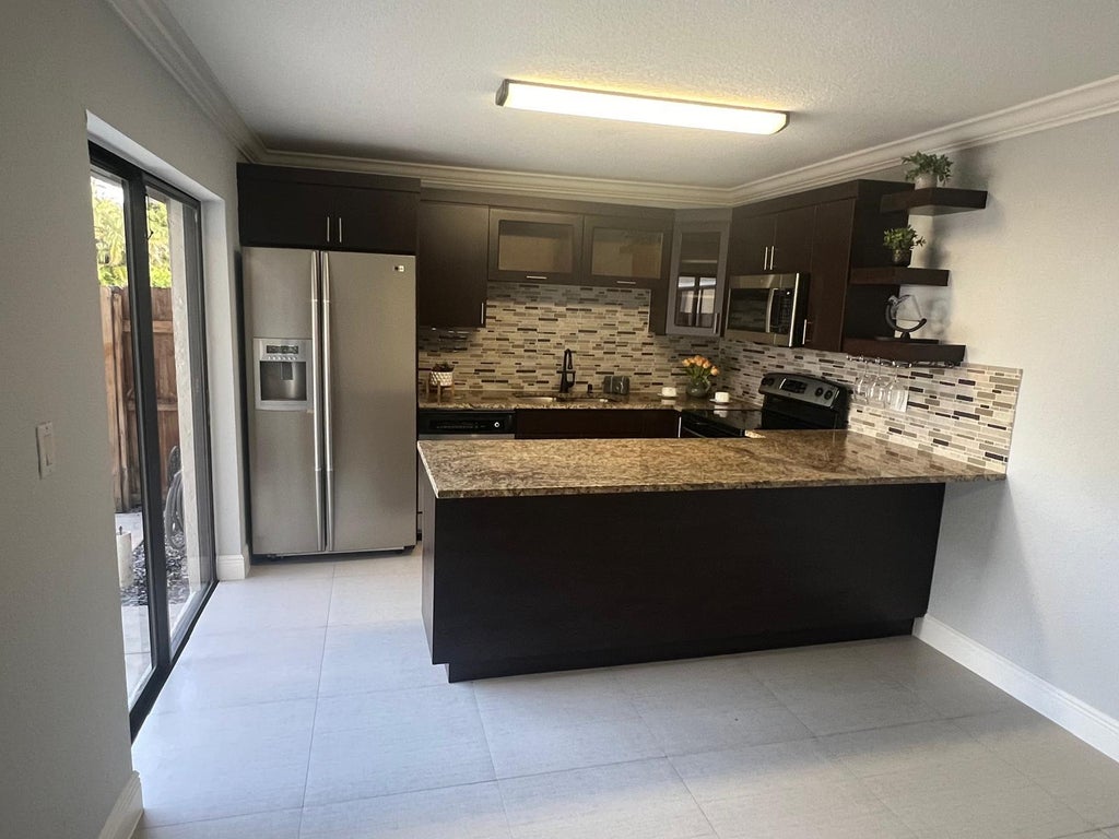 Photo of 2315 Caroma Lane, West Palm Beach, FL 33415 (MLS # B26081358)