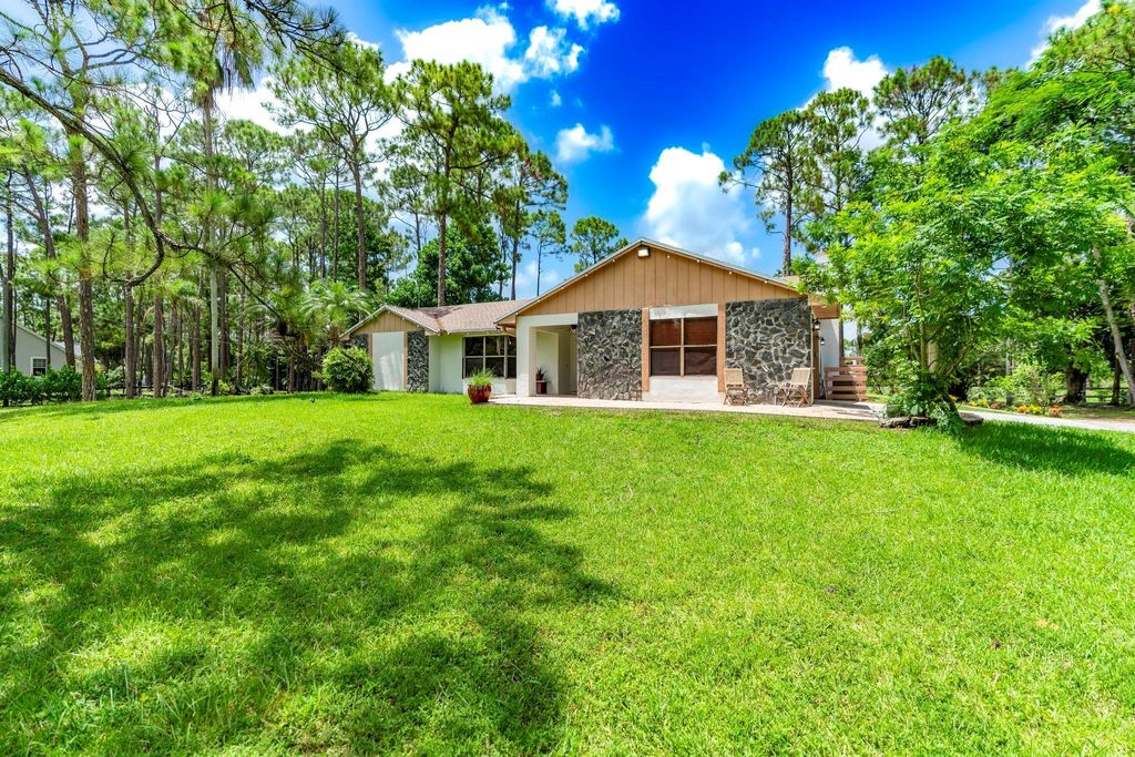 Photo of 15211 60th Place N, The Acreage, FL 33470 (MLS # R11110740)