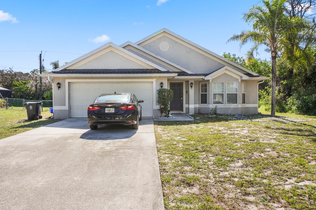 Photo of 609 NW Cardinal Drive, Port Saint Lucie, FL 34983 (MLS # B26026371)