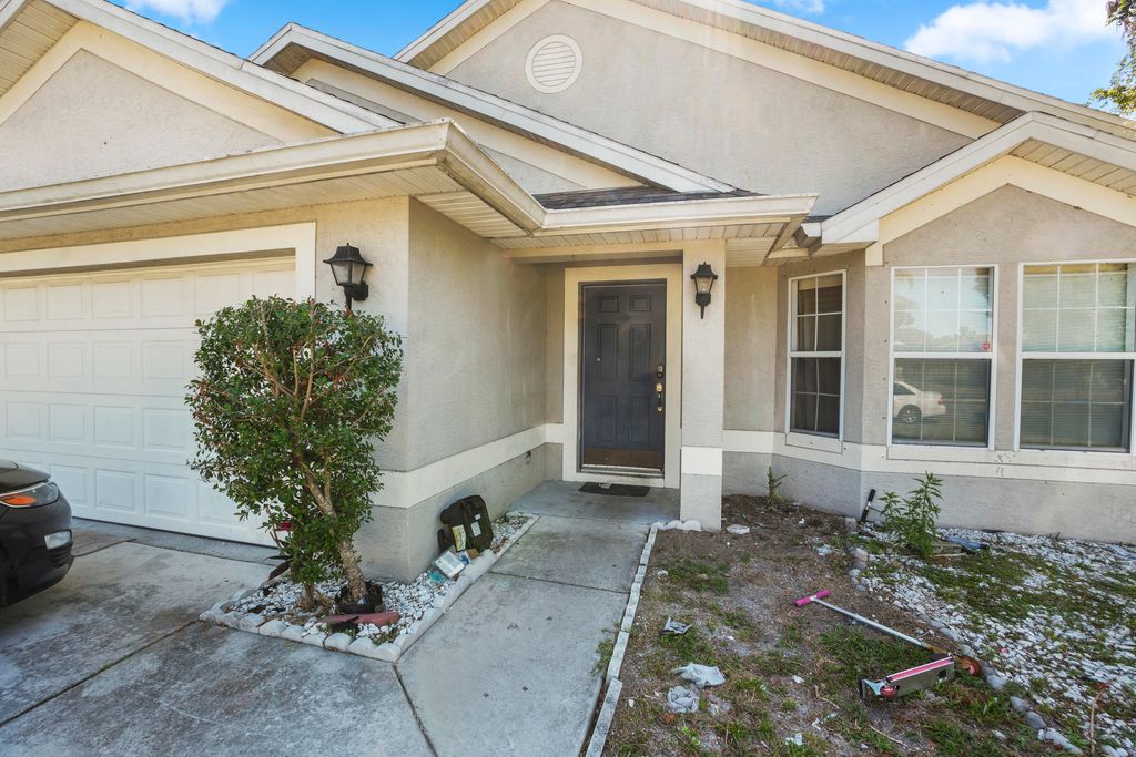 Photo of 609 NW Cardinal Drive, Port Saint Lucie, FL 34983 (MLS # B26026371)