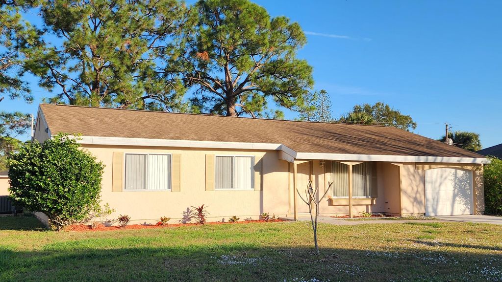 Photo of 651 NW Sharpe Street, Port Saint Lucie, FL 34983 (MLS # R11129932)