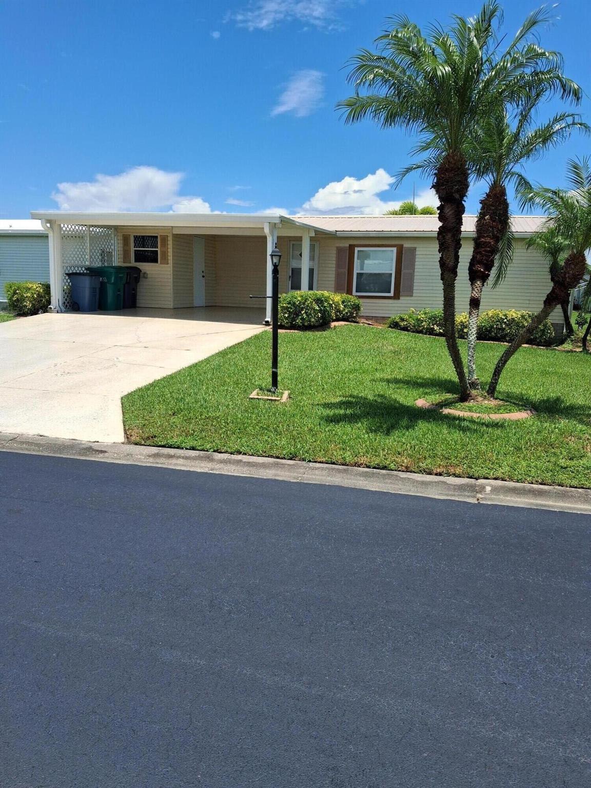 SEMINOLE COVE 2/2, partially furnished with 2 Master Suites and large closets. All the appliances are less than 2 years old (except stove that is 4 years old) AC unit is 2 years old. New windows. No steps to enter and covered carport for 2 vehicles. Rear enclosed patio with vinyl windows. Active retirement community that is close to shopping, restaurants and Lake Okeechobee. Measure room sizes for accuracy