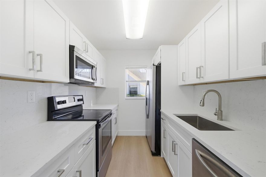 Investors - STOP SCROLLING! This completely updated, 1st floor, corner unit condo could bring in at least $2100 per month making this a cash flow dream! Brand new kitchen and baths, new stainless steel appliances, and AC & Water heater that were replaced in 2021. Low maintenance, no headaches! Unit comes with 1 assigned parking space but association will approve 2 cars, you just have to park the 2nd one in guest parking which there is plenty of! Peaceful water views from the backyard with plenty of green space. No popcorn ceilings. Whether you're looking for a turn-key place to call home or your next investment, this one checks all the boxes.