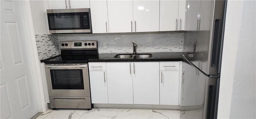 WOW!! COMPLETELY REMODELED and GORGEOUS! This Spacious Southwest Hallandale Beach end Unit Apt features 2 Large Spacious Bedrooms with a Completed Remodeled Bathroom and Kitchen. Owner spared no Expense Modern Kitchen with Granite Counter top, Glass Backsplash with New Stainless Steel Appliances, New Fans, New AC's New Porcelain Floors, Freshly Painted with Modern Fixtures. The property has a New Roof. Comes with two parking spacing and plenty of on street parking for guests. Water & Trash included. Good Location Quiet Southwest Hallandale community, minutes from Aventura and 10 drive to the beaches. Must have a minimum credit Score of 650 with a good rental history. NO pets.