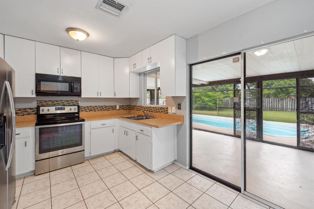 Photo of 2061 SE Mandrake Circle, Port Saint Lucie, FL 34952 (MLS # R11074157)