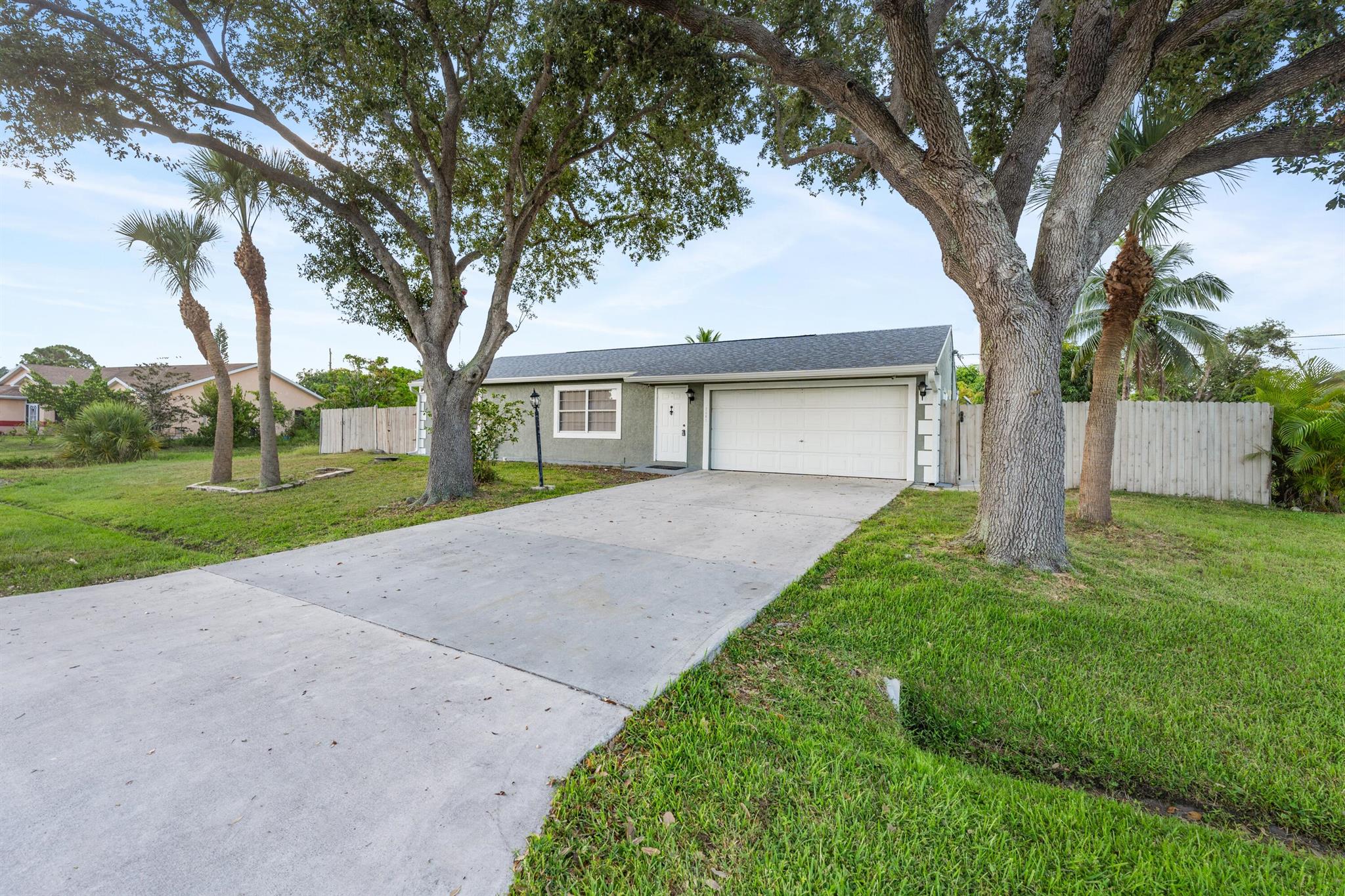 3/3 Pool Home: This charming property boasts a sparkling pool, perfect for cooling off on hot days. Home features a newer roof, ensuring peace of mind for years to come.Includes an efficiency, with a separate entrance, complete with its own kitchen, bathroom, and laundry room. This makes it ideal for multi-generational living or generating income as an Airbnb. Outdoor Oasis: Step outside to discover a fenced-in backyard, perfect for children and pets to play safely. Lush foliage creates a sense of privacy, while tropical fruit trees offer a delightful touch of nature. The screened-in pool and covered patio provide the perfect setting for relaxation and entertaining. This property is offering both comfort and convenience. Whether you're seeking a spacious family home or investment property