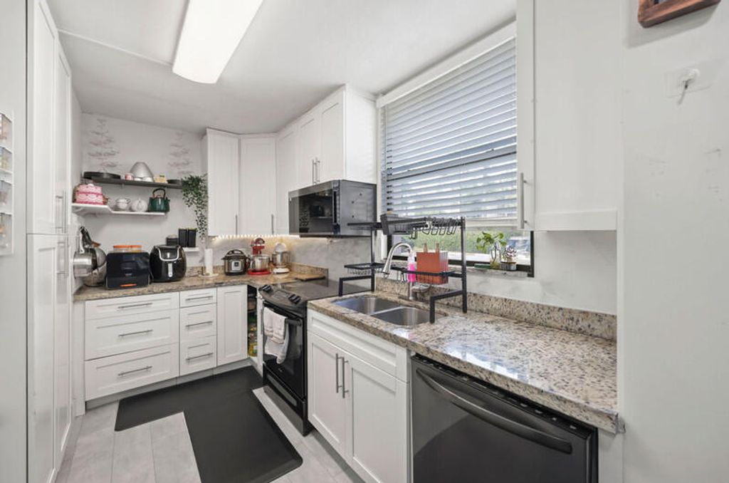 Photo of 8421 Forest Hills Drive #104, Coral Springs, FL 33065 (MLS # B26020646)