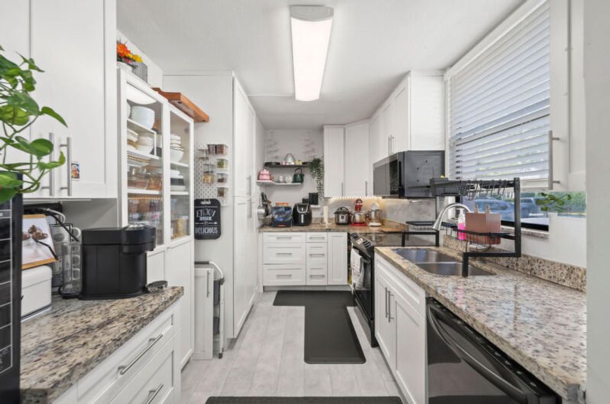 Set on the quiet, tree lined side of Greenglades, this first floor, all ages, condo offers a calm, grounded feel you rarely find at this price point. The renovated kitchen is truly a chef's kiss, adding warmth and style to the bright, open layout. Solid concrete construction keeps the home cool and quiet, and the private screened patio opens to an unexpectedly wide green space, perfect for morning coffee or peaceful evenings. Zoned for top rated schools including Forest Hills Elementary School, Coral Springs Middle School, and Coral Springs High School. With a pool, tennis, clubhouse, and strong rental appeal, this home blends comfort, convenience, and long term value.