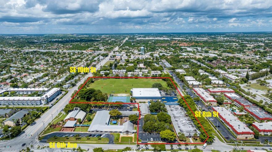 Extremely Rare Opportunity to purchase a +/- 10-acre High School campus in NE Broward County.  3  buildings totaling +/- 62,096 sf, + 1, 1440sf Portable building.
Total of 35 classrooms including science & computer labs. 2-story gymnasium building with stage, cafeteria, commercial kitchen, offices, lounge, lockers, weight & training rooms,  etc.
Grounds have a football/soccer field, tennis, basketball and sand volleyball courts, baseball & softball diamonds and a playground/park.  +/- 600 Student capacity. Over 570 ff on SE 10th St, signalized corner at SE 6th Ave. Minutes from many UHNW communities. Click on ''More'' for additional information. Site: 
9.96 Acres 433,783sf
CF Zoning -Community Facility
Flood Zone AH
+/- 573' on SE 10th St +/- 245' on SE 6th Ave Signalized Light
Campus:
3 Masonry Buildings +/-62,096 adj sf 1 Portable Building
+/- 600 Student Capacity
35 classrooms (incl. art, computer, and science labs) & media room.
N Building:
16,400sf adj sf built in 1966 
14 classrooms, media center teacher's lounge, offices and restrooms, copy room, restrooms
S Building:
4260 adj sf built in 1966
4 classrooms and maintenance area w/office
Portable Building:
1440sf 2 classrooms
Gymnasium Building:
 +/- 41,436 adj sf built in 1984
15 classrooms (incl, science and computer labs), offices, stage, cafeteria, kitchen, weight room, training room, boys/girls locker rooms, refrigeration and storage rooms.
Grounds:
Football/soccer field, softball and baseball diamonds, 2 tennis courts, 2 basketball courts, 1 sand volleyball court, playground/park
60 dedicated parking spots plus cross access/parking agreement with Zion Lutheran.

Tenant:
Somerset Academy Key Middle/High School

Irreplaceable location:
1.3 miles to I-95
2 miles to Boca Raton
2.4 miles to Lighthouse Point
4 miles to Hillsboro Mile
6.5 miles to Parkland
11 Miles to Delray Beach
14 miles to Fort Lauderdale

Terms:

Sold "As Is" subject to Buyer's inspections

Existing CF zoning - Seller will not consider any offer subject to a change in zoning

No Financing Contingencies

Somerset Academy tenancy

Shared access/parking agreement.

Please allow +/- 3 weeks for offer response time.

POF Letter to accompany all offers.

*Zion Lutheran Church and Preschool are not part of +/- 10-acre school campus sale and will not consider any offer to purchase which includes either the church and/or preschool.

All information is believed accurate but is not guaranteed and may be subject to errors and omissions and subject to changes without notice. All measurements are approximate.