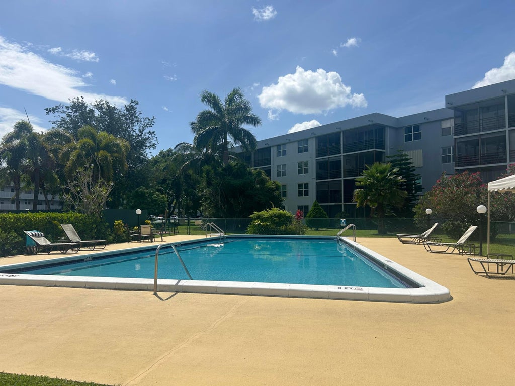 Photo of 109 Royal Park Drive #2c, Oakland Park, FL 33309 (MLS # B26042986)