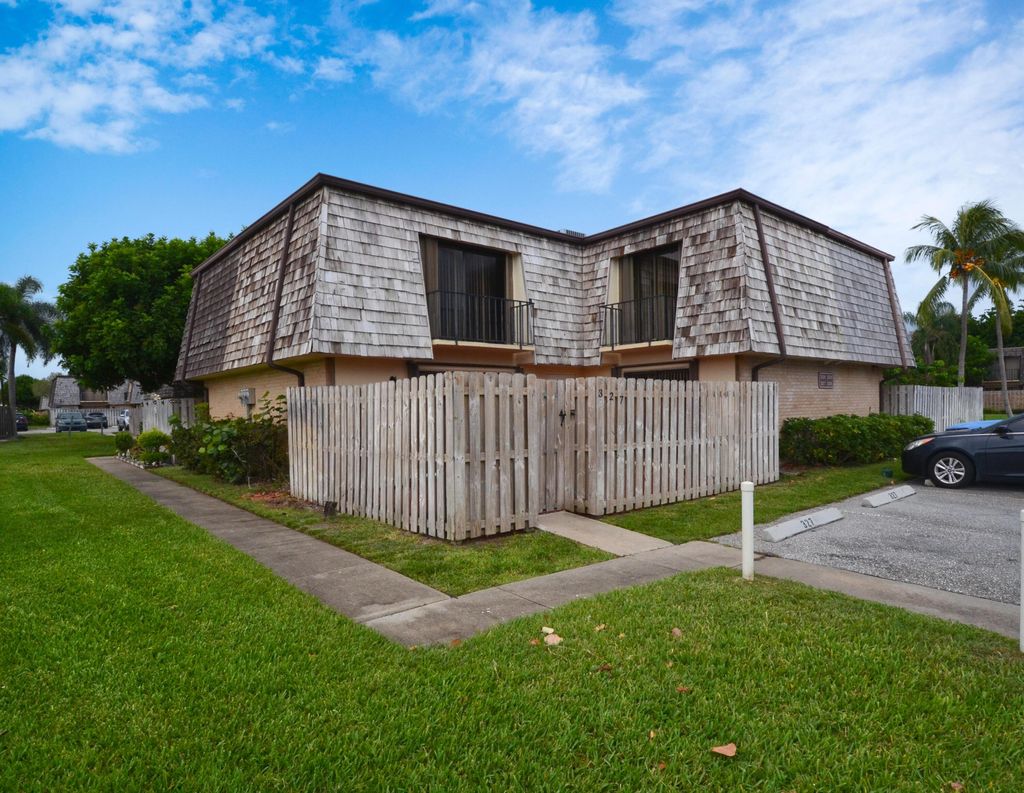 Photo of 327 Lake Arbor Drive, Palm Springs, FL 33461 (MLS # R11019614)