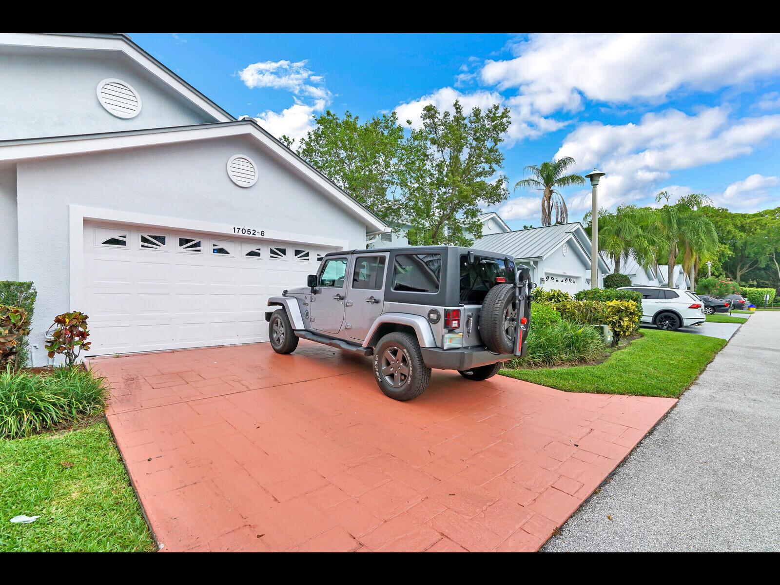 Welcome to your dream home in the heart of the desirable Boca Country Club! This beautifully updated 3-bedroom, 2.5-bathroom townhome offers an unparalleled lifestyle with breathtaking views of the golf course and serene lake. Centrally located, this spacious townhome features a primary suite conveniently situated on the ground floor, while the second floor includes two additional bedrooms and a full bathroom. Modern amenities include hurricane shutters and a 2-car garage. The community pool is directly across the street, perfect for relaxing and socializing. Families will appreciate being in an A-rated school district, and the proximity to shopping, dining, and the beautiful ocean beaches adds to the appeal.