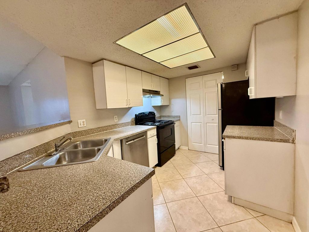 Photo of 5065 Wiles Road #105, Coconut Creek, FL 33073 (MLS # B26045175)