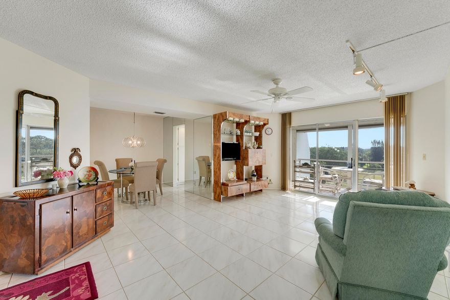 Welcome to beautifully maintained top floor Unit 607 in the enclave of Poinciana.  This unit offers natural light, privacy, and an expansive birds-eye view of the 18th fairway and pond with fountain aerator. With an eastern view, you can enjoy the morning sun on your screened in patio that adds to your living area.  The master bedroom offers two closets and ensuite bath. Enjoy the tranquil resort style pool complete with wi-fi service and clubhouse just down the short path with restaurant, entertainment, additional pool, golf, tennis, and pickleball. All of this and the convenience of minutes to shopping, turnpike, PBI, golf and local beaches. Condo fee includes hotwire TV, wi-fi, water, sewer, and pest control.  New HW heater. Outstanding value in Palm Beach County!