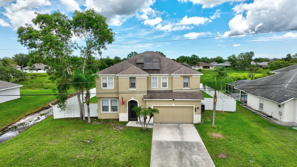 Photo of 6509 NW Omega Road, Port Saint Lucie, FL 34983 (MLS # R10998938)