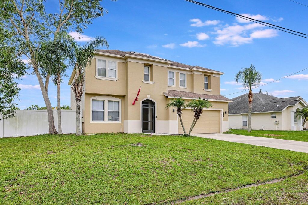 Photo of 6509 NW Omega Road, Port Saint Lucie, FL 34983 (MLS # R10998938)