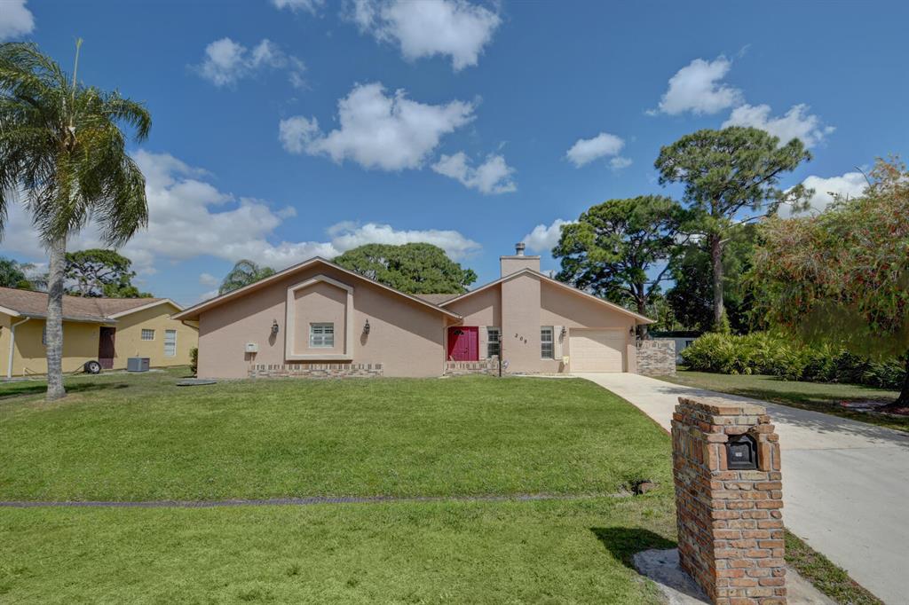Photo of 209 SW Eyerly Avenue, Port Saint Lucie, FL 34983 (MLS # R10701090)