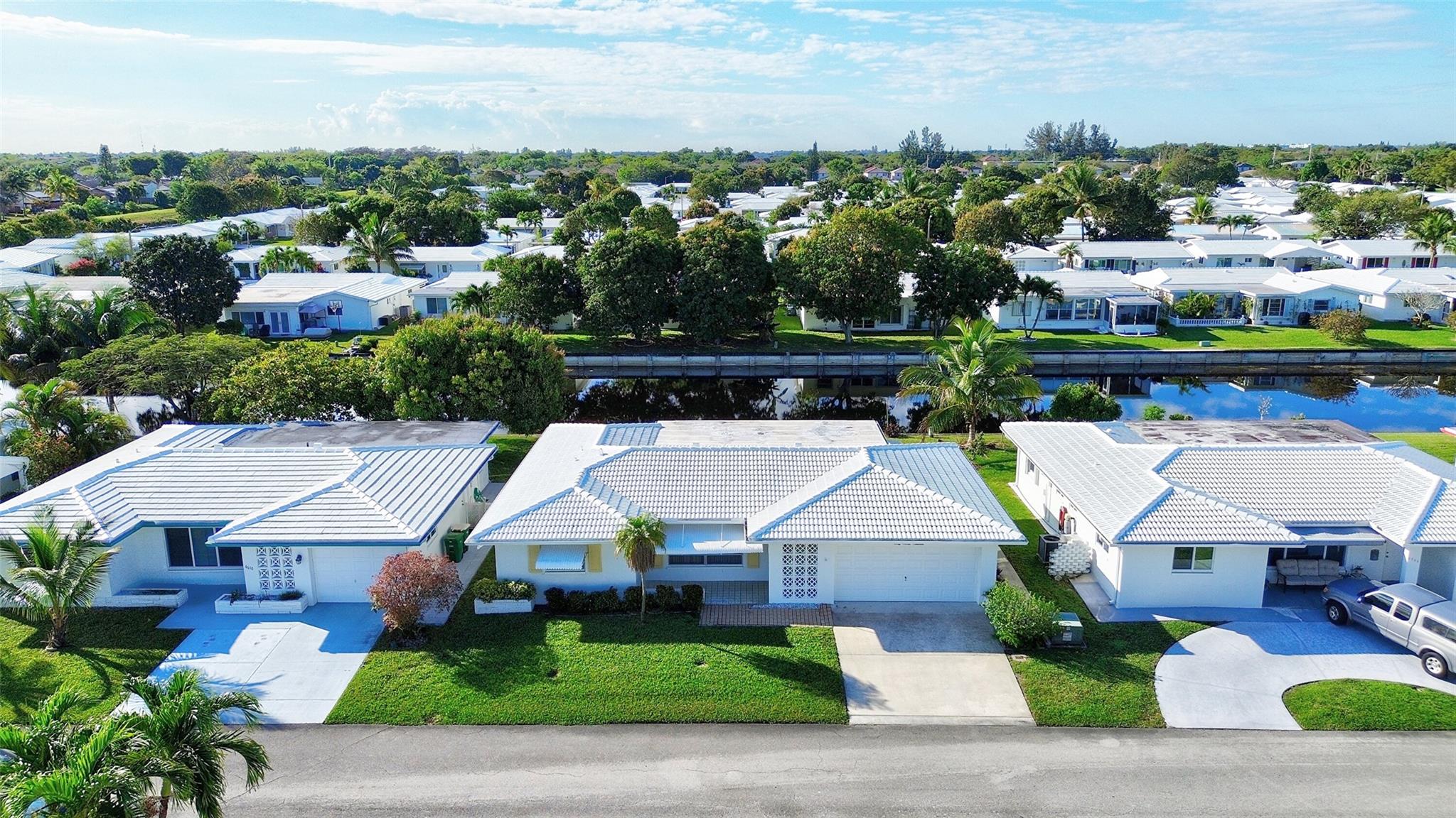 Discover an incredible opportunity in a 55+ community: a single-owner home, first time on the market in 54 years! This spacious gem is one of the largest models, featuring a rare two-car garage. Enjoy two bedrooms, two baths, and a colossal family room. The kitchen space is ready for your creative open-concept vision. Formal dining and living rooms add charm, with potential to convert an extra bedroom. Enjoy breathtaking waterfront views on a sprawling lot with a newer AC, Updated electrical and New roof. Low monthly maintenance covers lawn care and home painting. Enjoy the community pool and clubhouse. Seize this rare chance before it's gone!