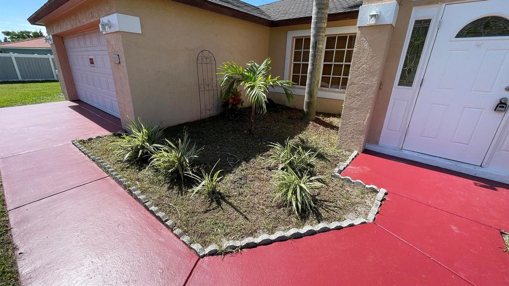 Photo of 2802 SE Awin Lane, Port Saint Lucie, FL 34952 (MLS # R11001042)