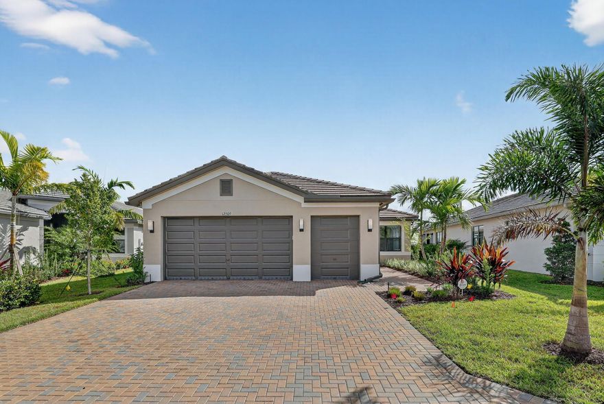 Welcome to your modern retreat in Riverland's Valencia Walk. Built in 2024, this 3BR/2BA home offers 2,100+ sq ft of bright, open living with a seamless flow from the spacious great room to the gourmet kitchen and dining area. The split floor plan features a private primary suite with a spa-like bath and generous closet space, plus two versatile guest bedrooms. Enjoy energy-efficient construction, a covered outdoor area, and an oversized lot with room to personalize. Located in a premier master-planned community with walking trails, parks, and resort-style amenities, all just minutes from shopping, dining, and I-95. Move-in ready and designed for today's lifestyle.