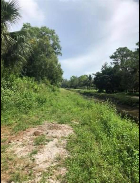 THIS IS THE ONE HOME BUILDERS HAVE BEEN WAITING FOR 1.48 ACRES ON A SECLUDED CORNER LOT WATERFRONT. WALKING DISTANCE TO GOLDEN GROVE ELEMENTARY SCHOOL,WESTERN PINES COMMUNITY MIDDLE SCHOOL,AND ACREAGE MONTESSORI ACADEMY DAY CARE,IT DOESNT GET ANY BETTER THAN THAT.WELLINGTON MALL APPROX 10 MIN RIDE.BUILD YOUR DREAM HOME HERE CLOSE TO SHOPPING, BANKS,SCHOOLS AND PARKS. NO HOA,BRING YOUR RV,BOAT,HORSES TRAILERS A TRUE PARADISE COULD BE YOURS