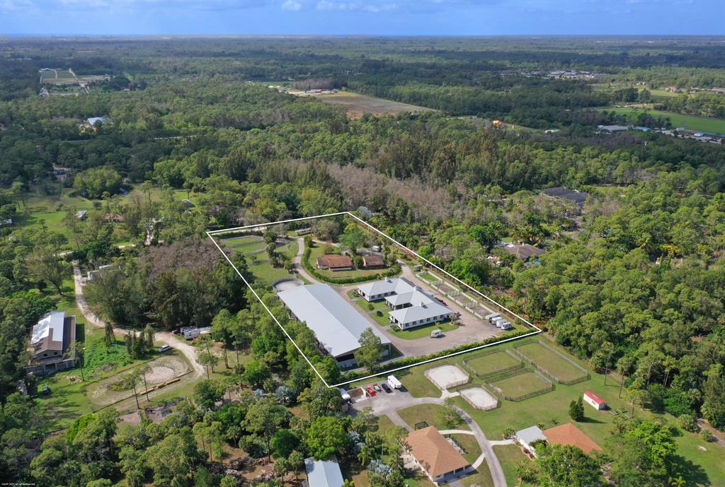 Newly built in 2019, this 27 stall stable and covered riding arena are waiting for you to make it your own with finishing touches! The stable boasts 27 stalls, 2 tack rooms, lounge / studio apartment with full bath, brick paver aisleway, 2 feed rooms, hay/ storage room, 6 wash stalls & 4 dry tack stalls. Other features include: central fly spray, guest powder room, water to each stall for automatic watering & insulated metal roof. The 85' x 220' covered arena has rain gutters, GGT footing, mirrors and irrigation system. You'll also enjoy the perimeter hacking path & irrigated round pen. There is a 4Br /2bth home built in 1971 with 2 car garage which is perfect for staff or a fun remodel. Located just minutes from all of Wellington's competition venues. All this at a great price!