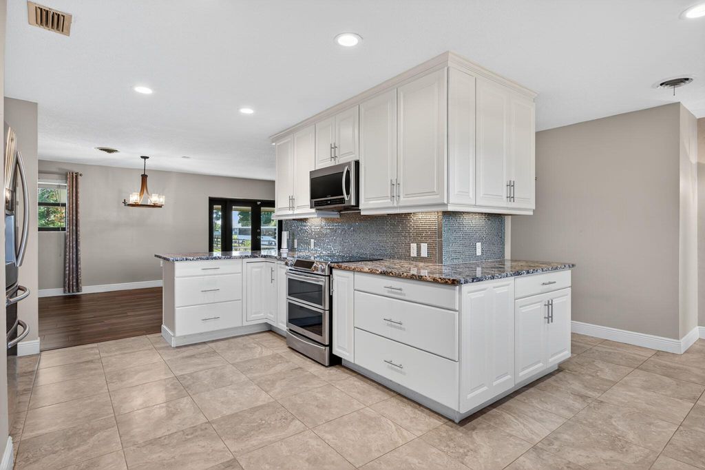 Photo of 1732 SE Avenue J, Belle Glade, FL 33430 (MLS # R11133591)