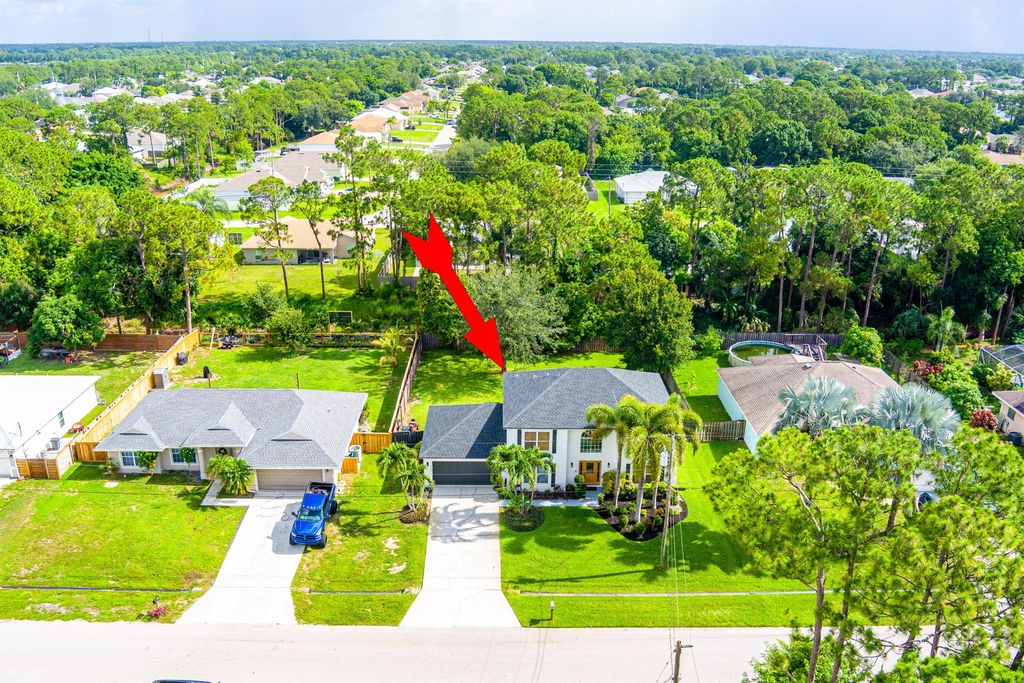 Photo of 1571 SW Delos Avenue, Port Saint Lucie, FL 34953 (MLS # R11099267)