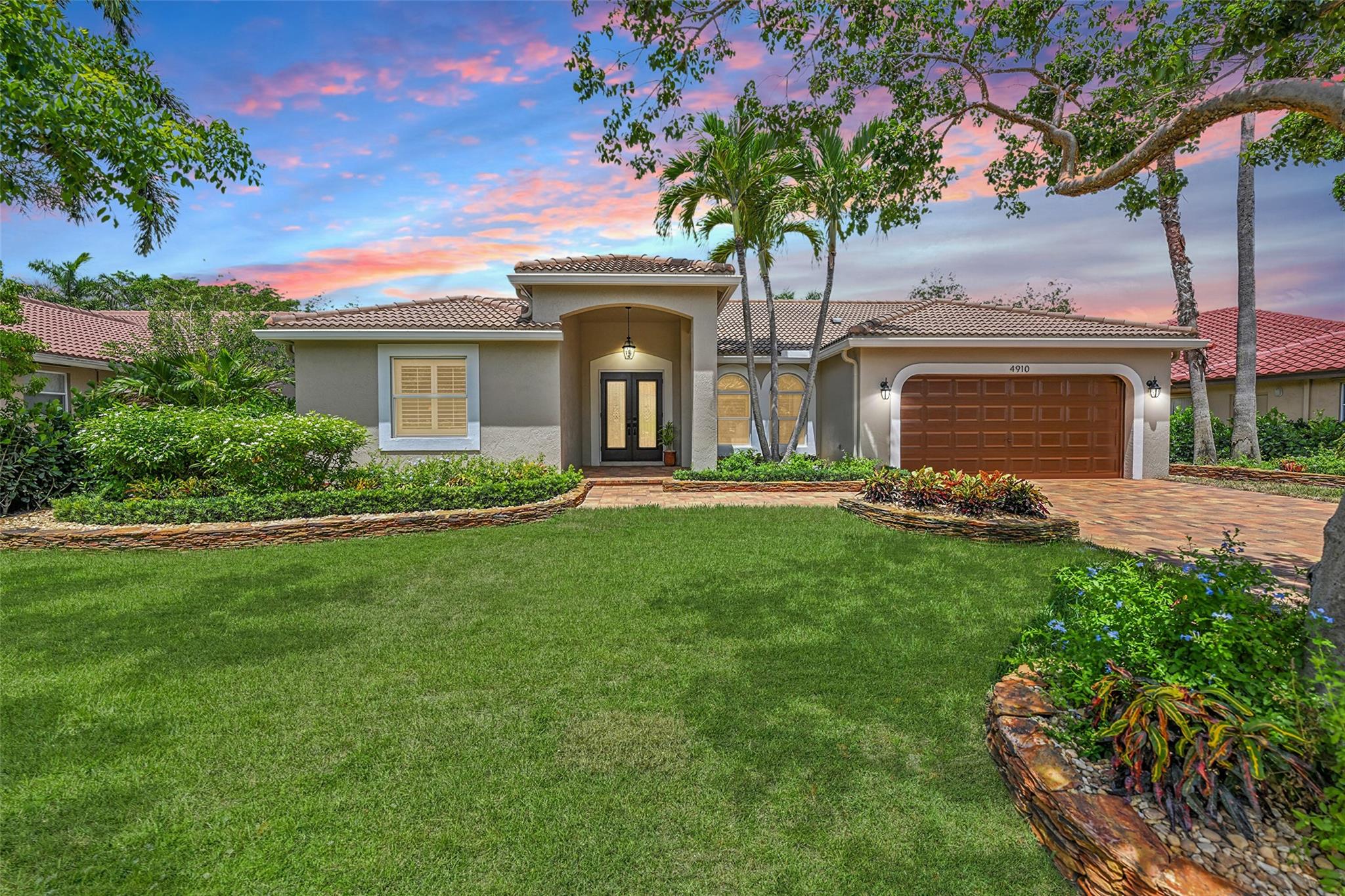 Amazing home where the outdoors is just as impressive as the inside. Professionally landscaped with tropical flair, with over $250K in upgrades! Modern split 5 bedroom 2.5 bath pool home features high ceilings, porcelain tiled floors & luxury vinyl plank flooring. New kitchen cabinets, backsplash & stainless steel appliances. Plantation shutters, IMPACT GLASS windows & doors with natural light throughout. LED recessed lighting, renovated primary ensuite with separate soak tub, new vanity & flooring. Primary bedroom with walk in closets! Top rated schools, parks, museum, and shopping. Perfect blend of design, function, and Florida charm. 2 Car Garage with epoxy floors, a sink tub & a hookup for generator. Gorgeous new pavers in driveway! HOA FEES LESS THAN $53 PER MONTH! Great opportunity