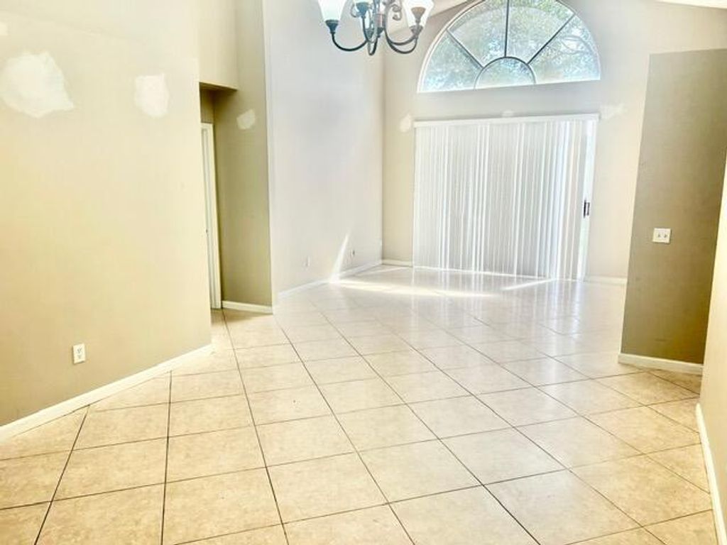 Photo of 7584 Thornlee Drive, Greenacres, FL 33467 (MLS # B26012078)