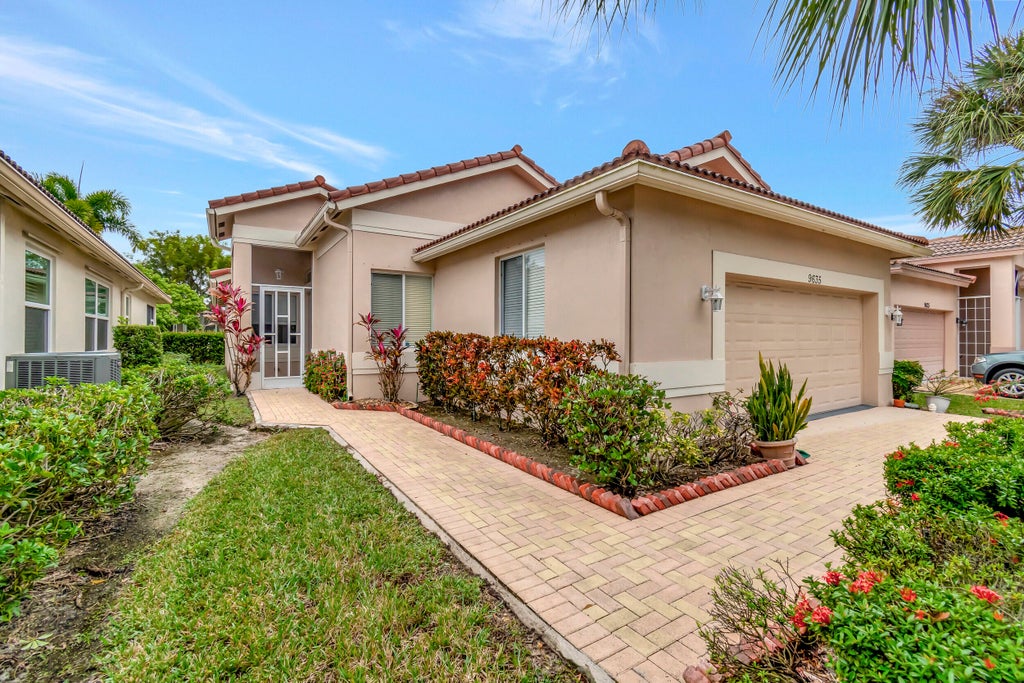 Photo of 9635 Sandpiper Shores Way, West Palm Beach, FL 33411 (MLS # B26037122)