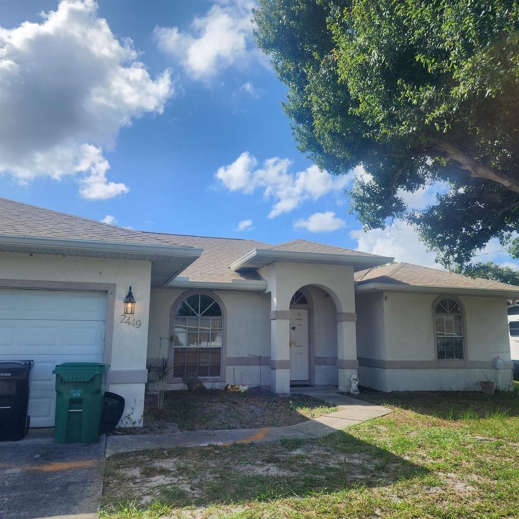 Photo of 2449 SE Rock Springs Drive, Port Saint Lucie, FL 34952 (MLS # R11005114)
