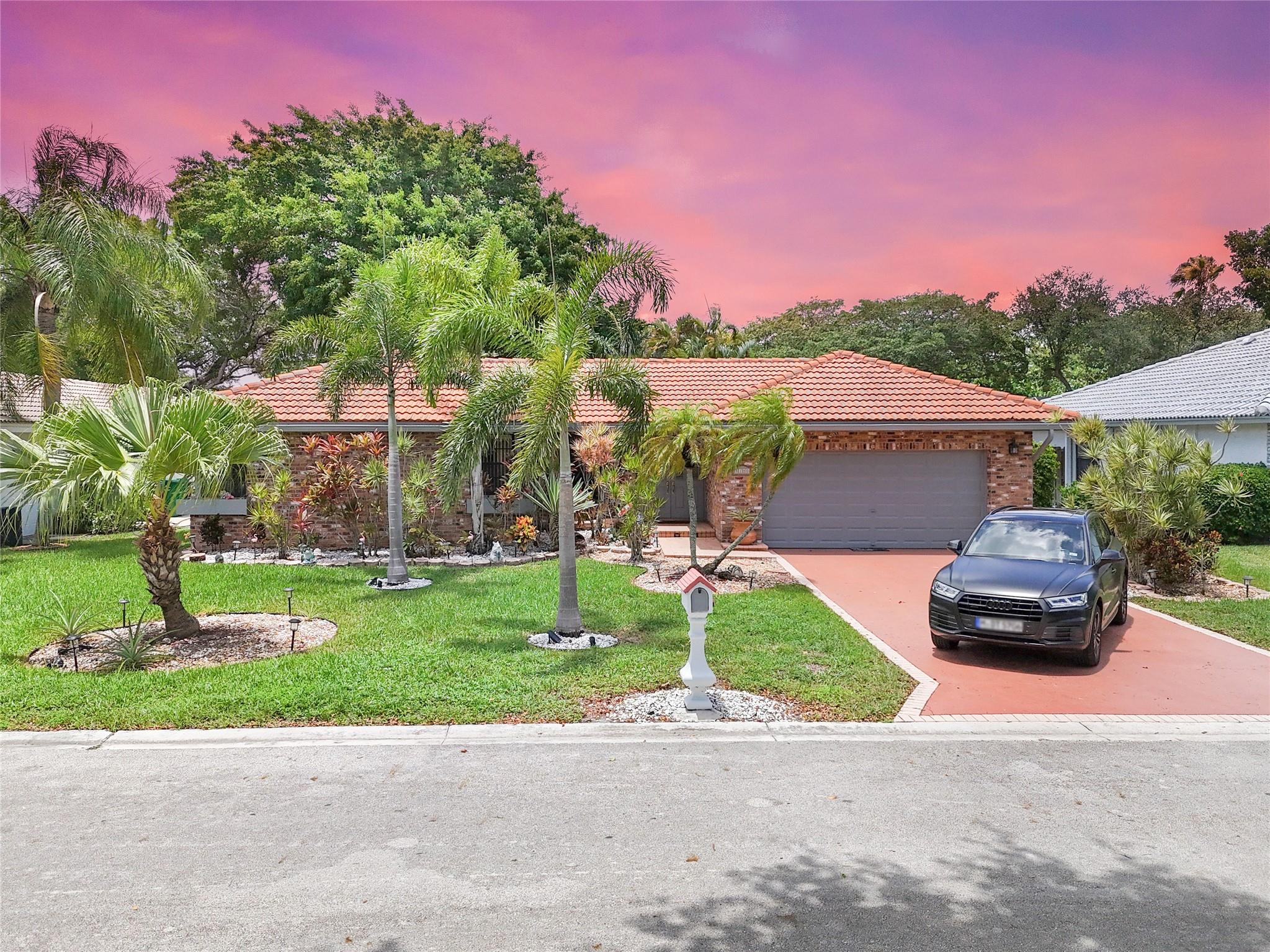 Modern comfort meets timeless charm in this Coral Springs stunner! Step inside and feel the vibe—vaulted ceilings, tons of natural light, and a spacious layout that flows effortlessly from room to room. The open-concept kitchen is ready for your next dinner party, featuring sleek granite counters, stainless steel appliances, and plenty of storage. Outside? Your private backyard oasis awaits with a sparkling pool, lush landscaping, and room to unwind or entertain in style. Located on a quiet street in a highly sought-after neighborhood, with top-rated schools, parks, and shopping just minutes away. Low HOA, freshly painted exterior and a MOTIVATED SELLER!
