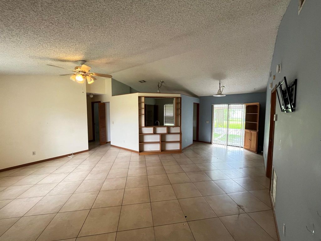 Photo of 2955 SW Varsity Lane, Port Saint Lucie, FL 34953 (MLS # R11096224)
