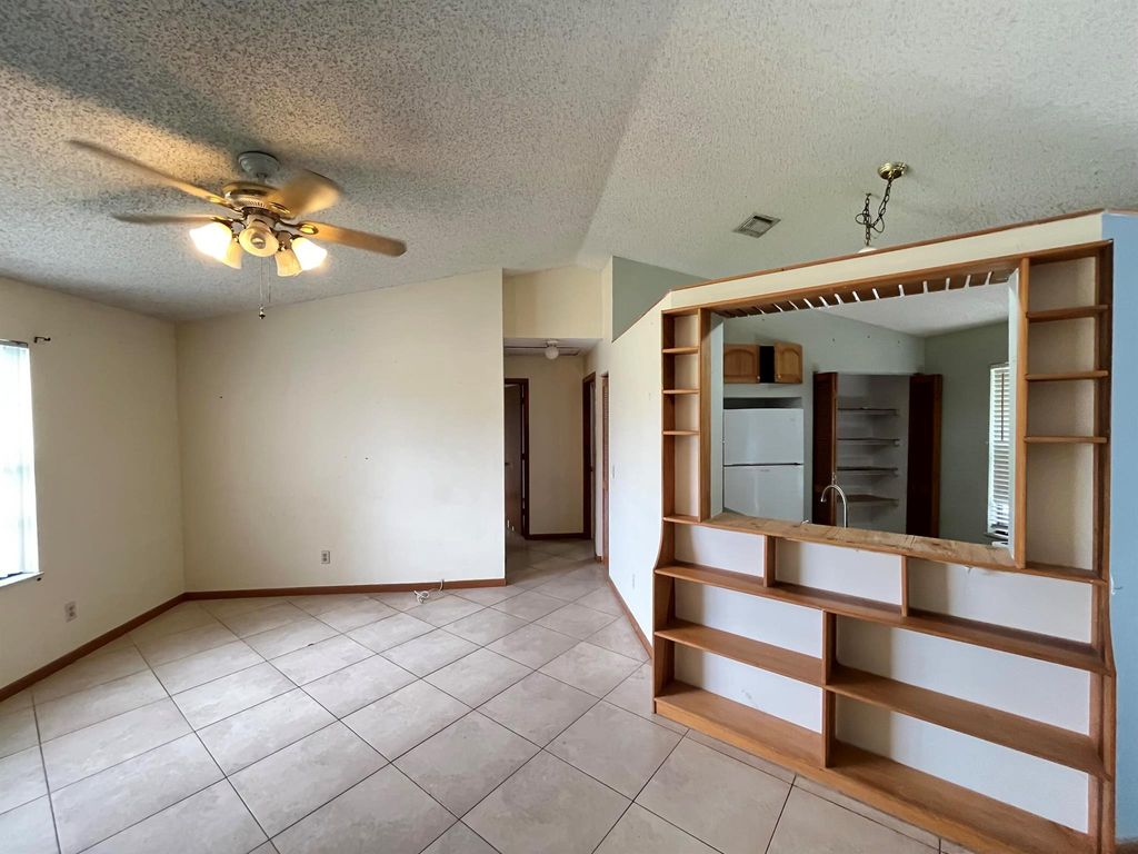 Photo of 2955 SW Varsity Lane, Port Saint Lucie, FL 34953 (MLS # R11096224)